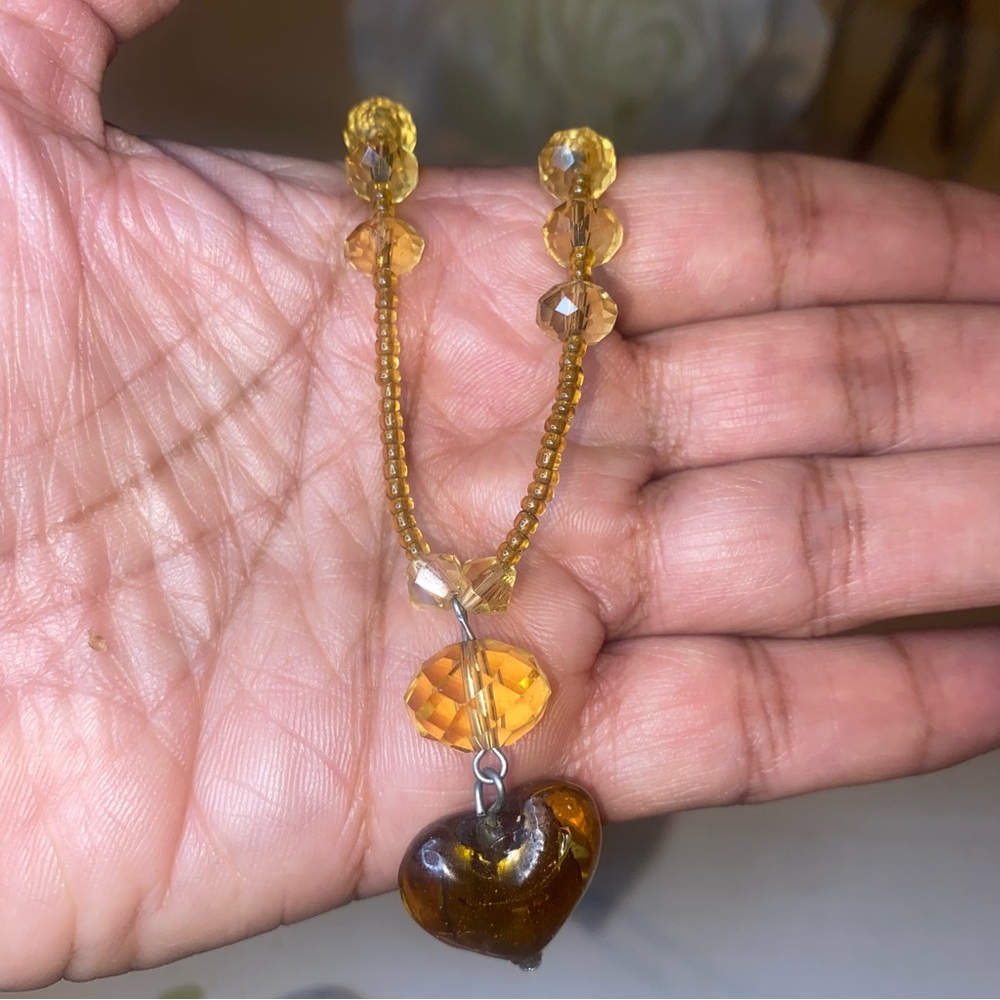 A Beautiful 10 Inches Glass Brown Beads Necklace with a Heart-Shaped Pendant